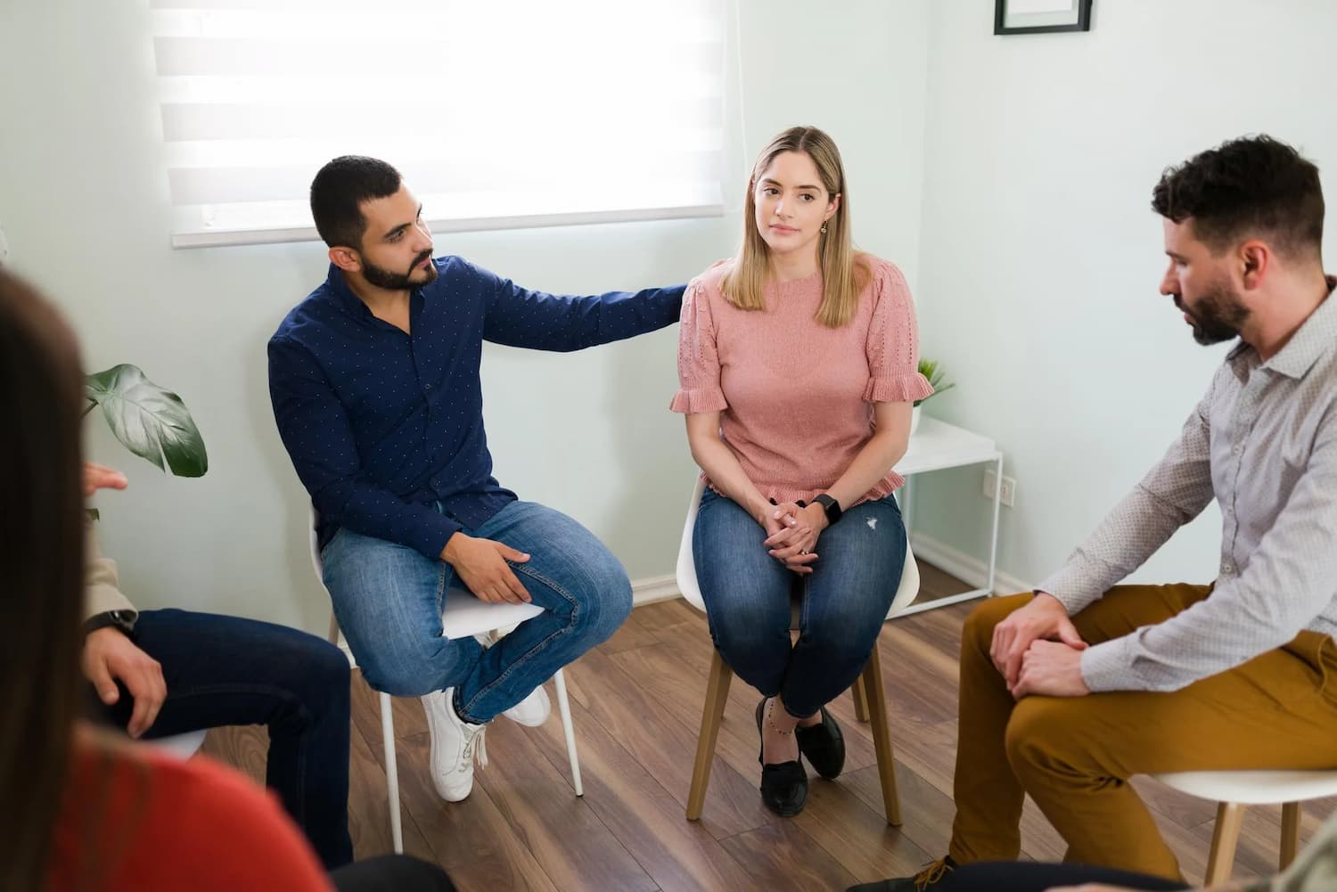 A support group discussing using Medicaid for mental health