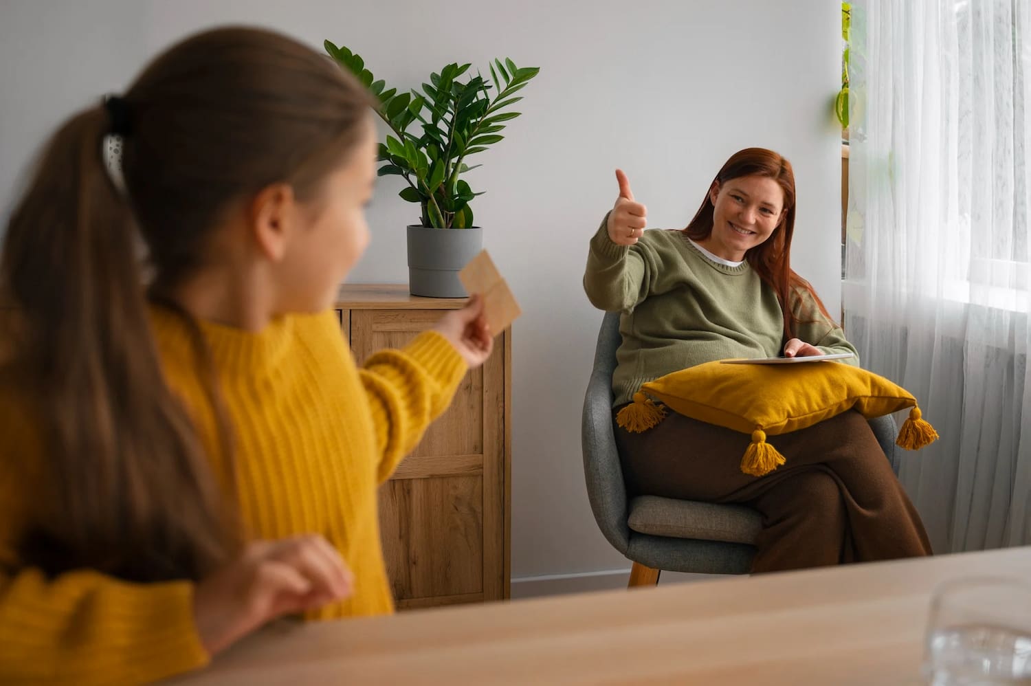 Woman smiling with a thumbs up about mental health support