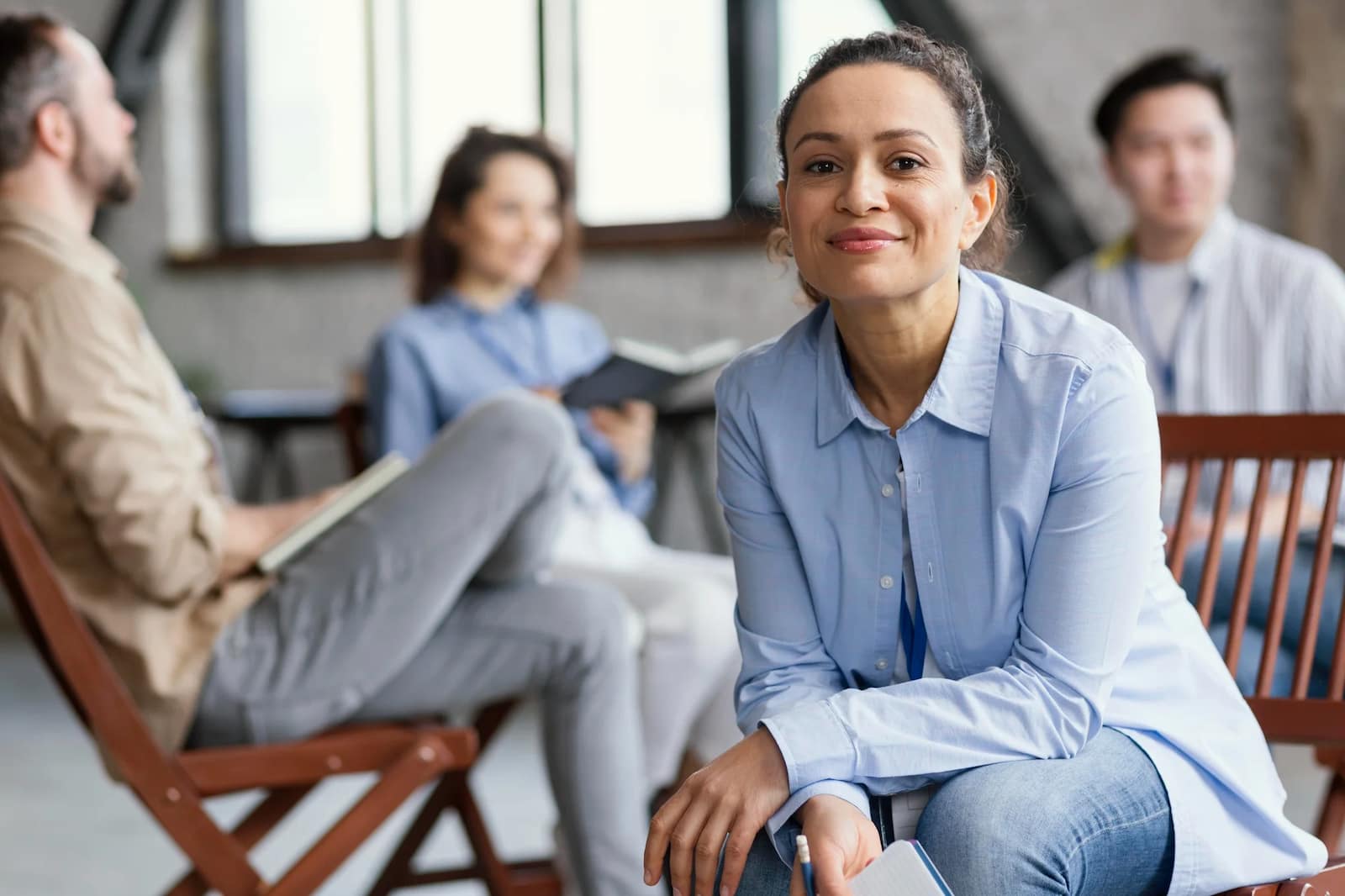 A woman smiling while in a mental health therapy session
